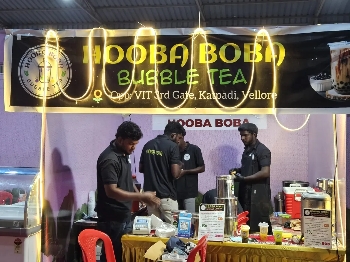 Hooba Boba team serving bubble tea at an event stall in Vellore