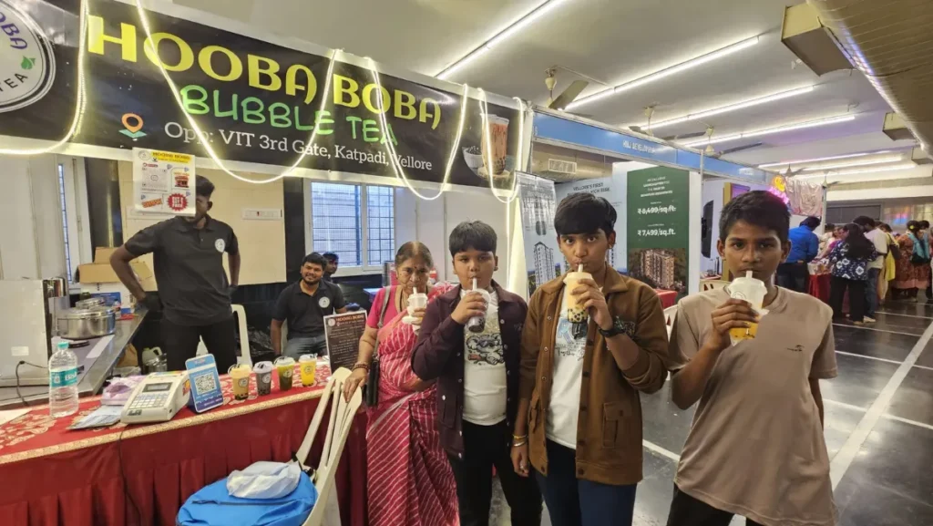 Family enjoying Hooba Boba bubble tea at our stall at an expo in Vellore